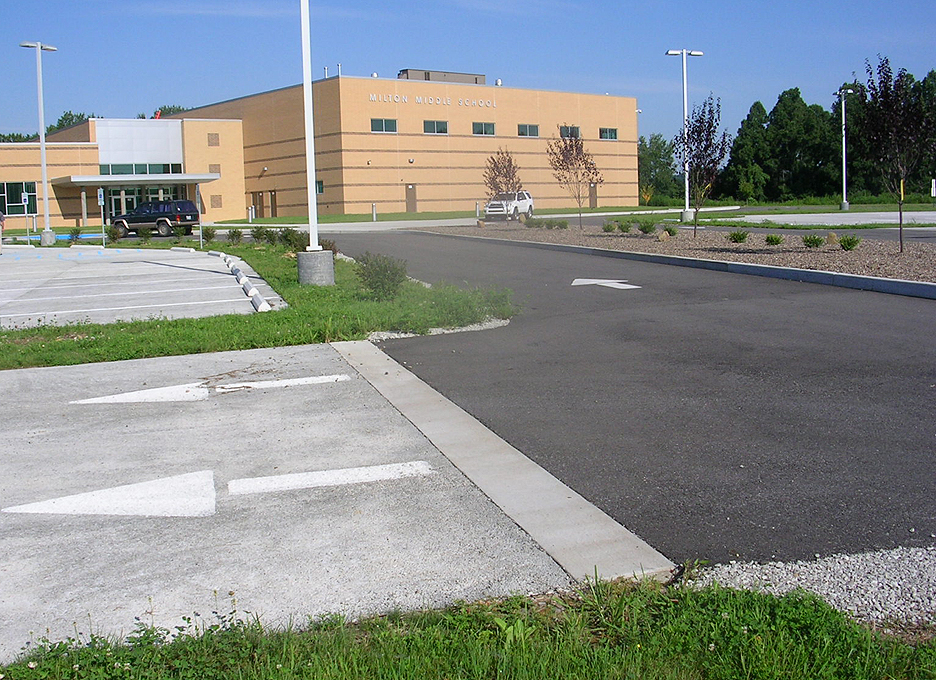 Milton Middle School porous concrete parking lot. The lighter color parking lot is porous, the darker color is traditional blacktop, which is not porous. The school is located in Cabell County, WV and was constructed in the summer of 2009