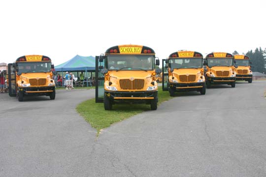 Parked fleet of new yellow school buses