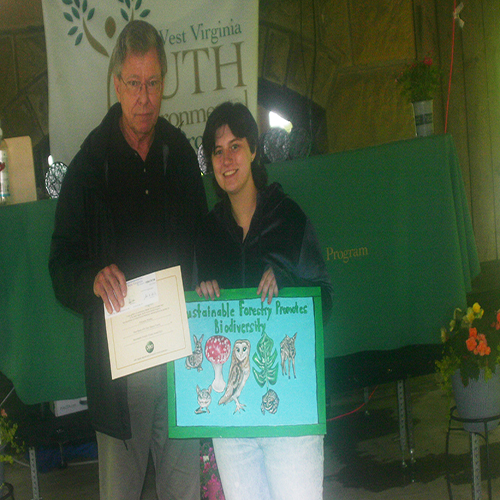 Ed Maguire presenting the Sustainable Forestry Art Poster Contest Award to winner Emmalea Warden
