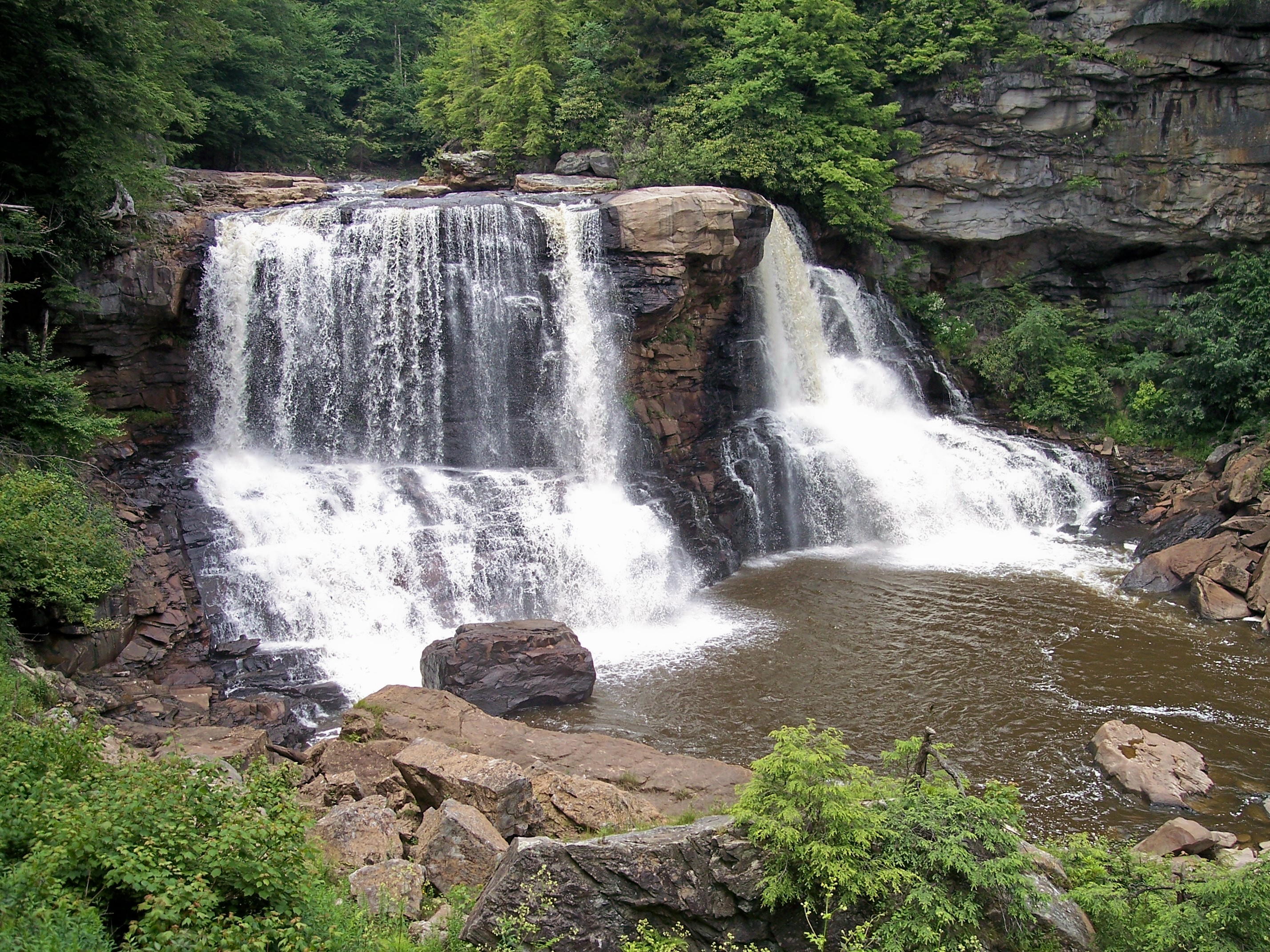 Black water flowing over steep cliffs