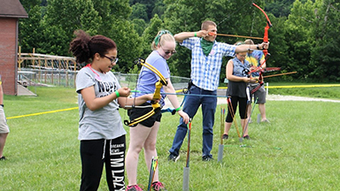 JCC attendees practicing archery.