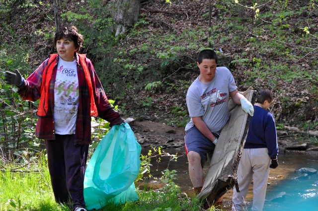 Teenagers cleaning up Lick Creed during the Make It Shine 2010 Cleanup.